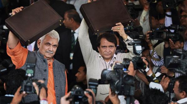 Union Minister for Railways, Suresh Prabhu along with MOS Manoj Sinha arrive at Parliament for presenting the Railway Budget 2016-17, in New Delhi. (Source: PTI)