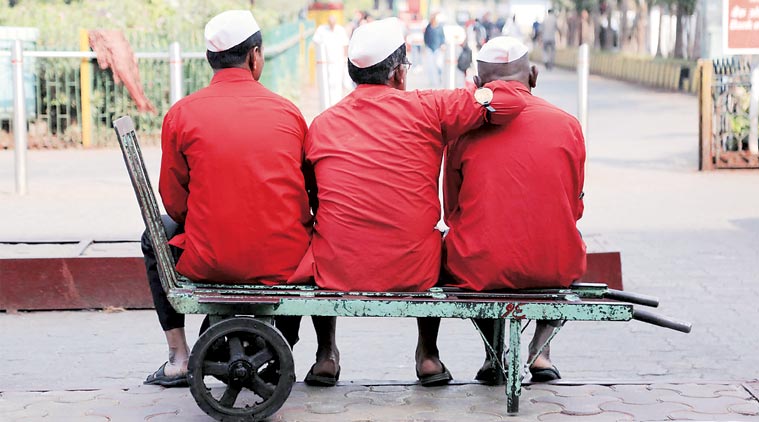 Railway porters in Mumbai on Thursday. They will be called sahayaks, not coolies. (Expres Photo: Amit Chakravarty)