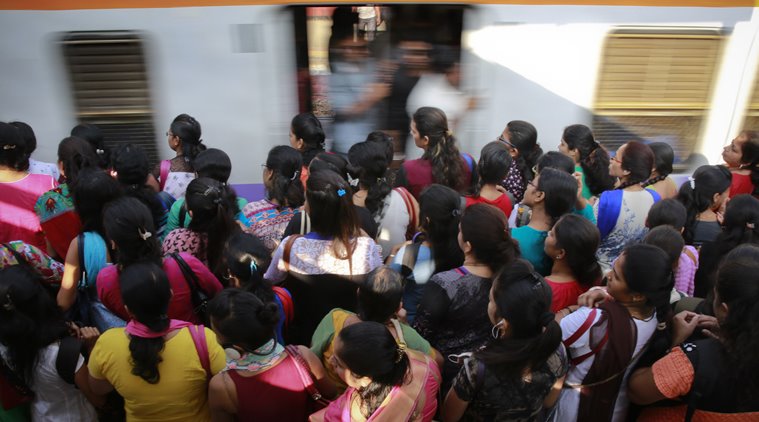 Indian commuters wait for their train in Mumbai, India, Wednesday, Feb. 24, 2016. Railway Minister Suresh Prabhu unveils the budget Thursday for India’s immense railroad network, once a pride of the Indian government but now hobbled by aging infrastructure. (AP Photo/Rafiq Maqbool)