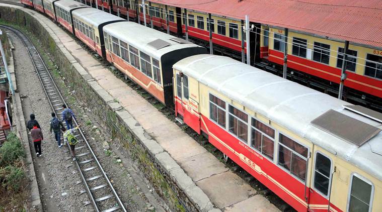 People walk along with railway track at railway station in Shimla. The interim Railway Budget 2015-16 presented in the Lok Sabha by railway minister Suresh Prabhu on Thursday. Express photo by Lalit Kumar. 26.02.2015.