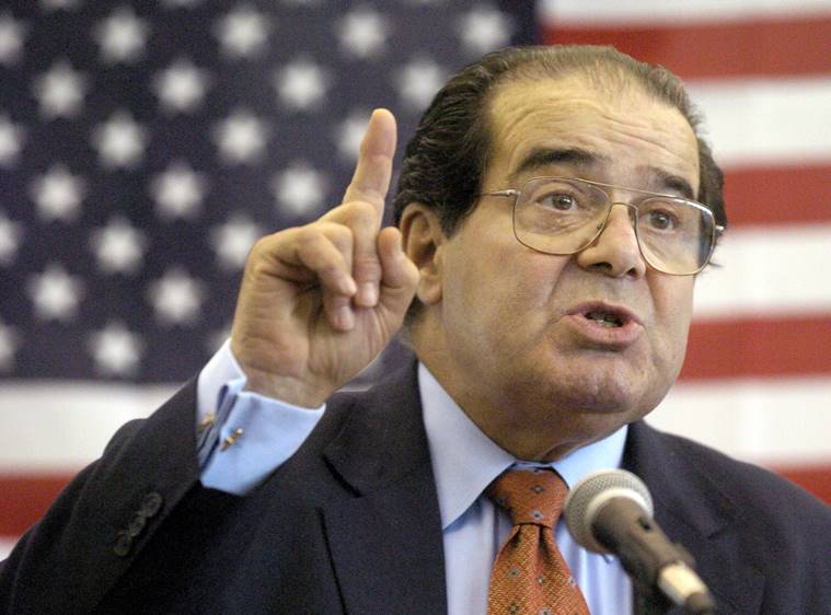 FILE - In this Wednesday, April 7, 2004 file photo, U.S. Supreme Court Justice Antonin Scalia speaks to Presbyterian Christian High School students in Hattiesburg, Miss. On Saturday, Feb. 13, 2016, the U.S. Marshals Service confirmed that Scalia has died at the age of 79. (Gavin Averill/The Hattiesburg American via AP)