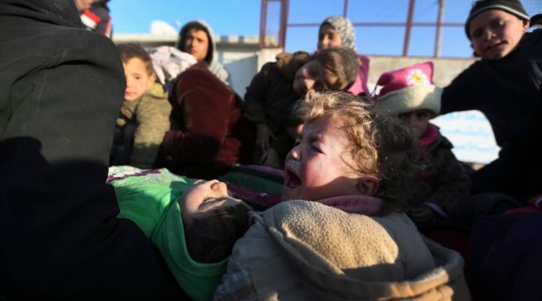 A child cries as Syrians arrive at the Bab al-Salam border crossing with Turkey, in Syria, Saturday, Feb. 6, 2016. Thousands of Syrians have rushed toward the Turkish border, fleeing fierce Syrian government offensives and intense Russian airstrikes. Turkey has promised humanitarian help for the displaced civilians, including food and shelter, but it did not say whether it would let them cross into the country. (AP Photo/Bunyamin Aygun) TURKEY OUT