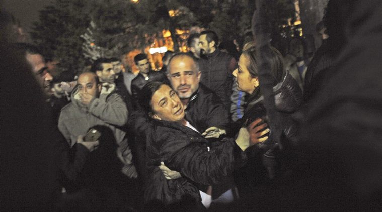 Relatives of people wounded in an explosion in Ankara, Turkey, react as they arrive at a hospital to see their loved ones, late Sunday, March 13, 2016. The explosion is believed to have been caused by a car bomb that went off close to bus stops. (Osmancan Gurdogan/Depo Photos via AP) TURKEY OUT