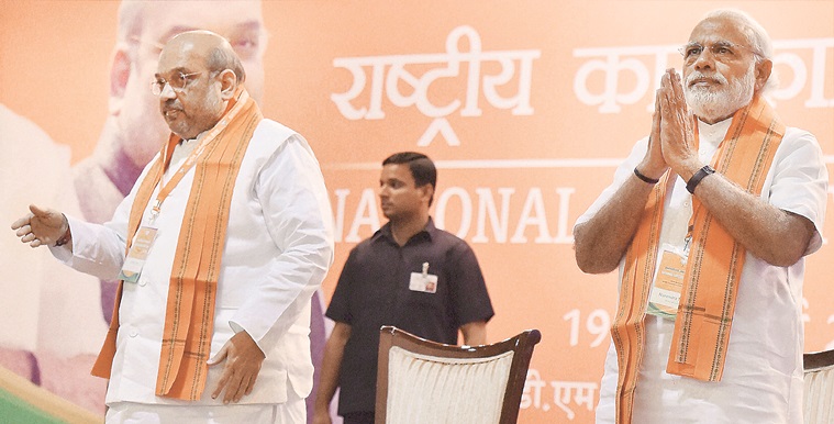 New Delhi: Prime Minister Narendra Modi and BJP President Amit Shah at party's National Executive meet, in New Delhi on Saturday.  PTI Photo by Kamal Kishore   (PTI3_19_2016_000182A)