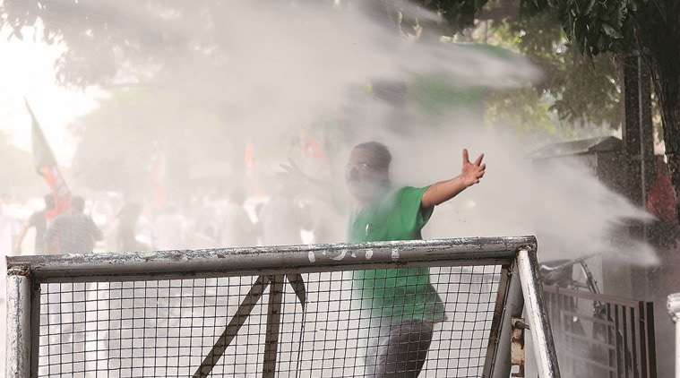 police use water canon on BJP workers during protest against Sashi Tharur at Chandigarh on Friday, March 25 2016. Express photo by Jasbir Malhi