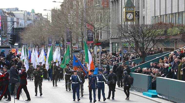 Thousands of soldiers march solemnly through the streets of Dublin, Ireland, Sunday, March, 27, 2016. Thousands of people took part in the 100th anniversary of Ireland's Easter Rising against Britain, a doomed rebellion that reduced parts of the capital to ruins and inspired the country's eventual independence. (AP Photo/Peter Morrison)