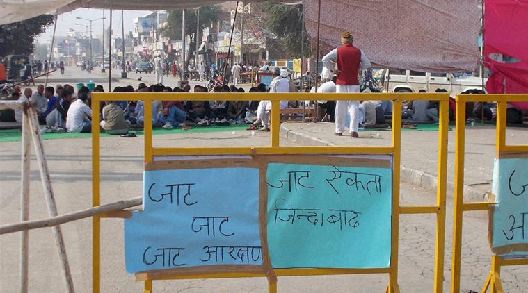 Hisar: People of Jat community block a road in Hisar during their agitation for reservation on Saturday. PTI Photo (PTI2_20_2016_000184B)
