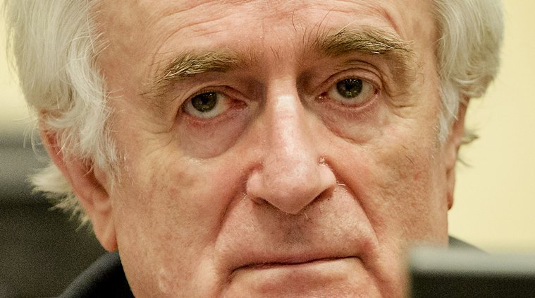 Bosnian Serb wartime leader Radovan Karadzic in the courtroom for the reading of his verdict at the International Criminal Tribunal for Former Yugoslavia (ICTY) in The Hague, The Netherlands Thursday March 24, 2016. The former Bosnian-Serbs leader is indicted for genocide, crimes against humanity, and war crimes. (Robin van Lonkhuijsen, Pool via AP)