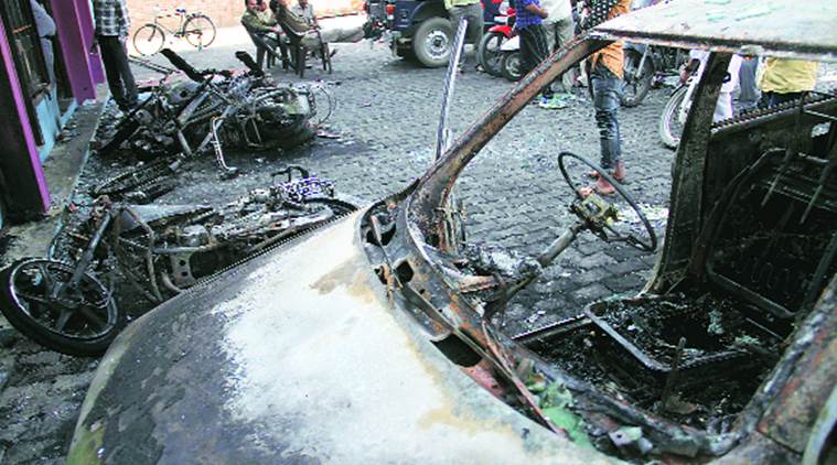 Burnt vehicles in Mawana, Saturday. Gajendra Yadav