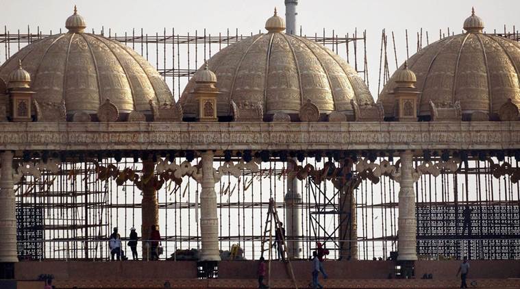 New Delhi:  Workers prepare stage for the three-day World Peace Festival organised by spiritual guru Sri Sri Ravi Shankar in New Delhi on Tuesday.  PTI Photo by Kamal Kishore (PTI3_8_2016_000256A)