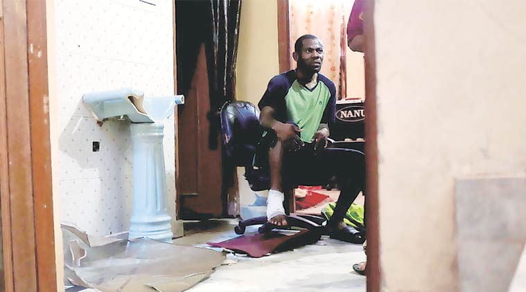 Evwrirhe Isaac told police a mob barged into his house and beat him up with baseball and cricket bats. (Express Photo: Cheena Kapoor)