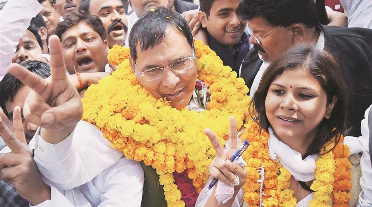Allahabad : SP candidate Vasudev Yadav celebrates as he win state Legislative Council seat in Allahabad on Sunday.PTI Photo(PTI3_6_2016_000140B)