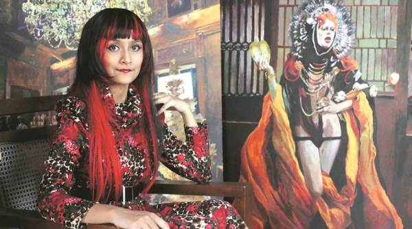 Pracheta Banerjee with one of her artworks in the background (Express photo by Partha Paul)