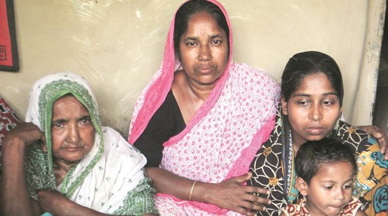 Farida Bibi (extreme left), wife of Rezaul Islam (below) who was killed in police firing, with other family members at their home, in Illambazar on Wednesday. Subham Dutta