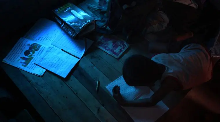 Shahid Hussain studying during his 'tuition' hours in the slums near Madanpur Khadar. Shahid is a Rohingya muslim and arrived in Delhi in 2012 after fleeing from his native country Myanmar. They went to Bangladesh first and arrived in Delhi in 2012. Express photo by Oinam Anand. 17 May 2015