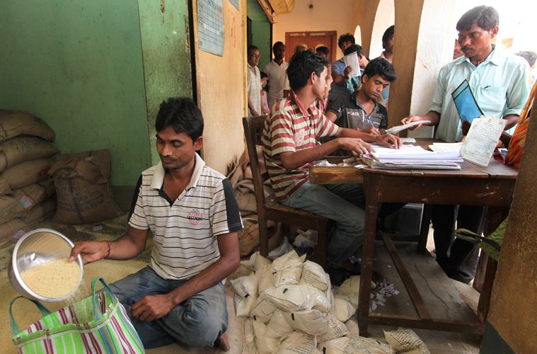 Rice @ Rupees 2 per kg distributed from a ration shop Belatikri under Lalgargh PS on Sunday. Express photo by Partha Paul.Jhargram.27.03.16