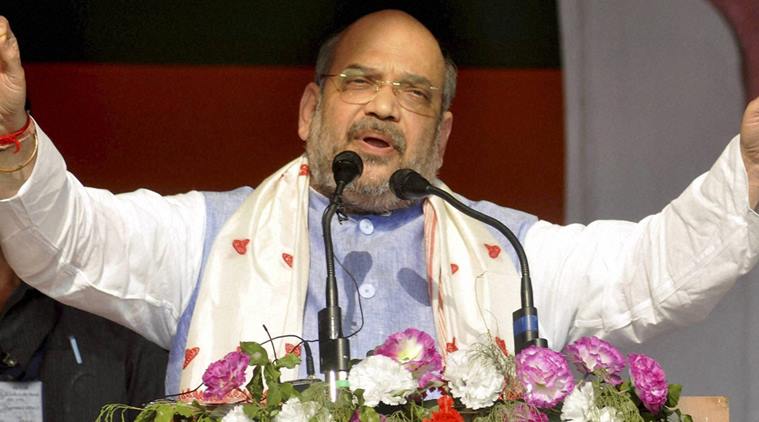 Sualkuchi: BJP president Amit Shah addressing an election rally at Sualkuchi in Kamrup district of Assam on Saturday. PTI Photo(PTI4_9_2016_000115A)