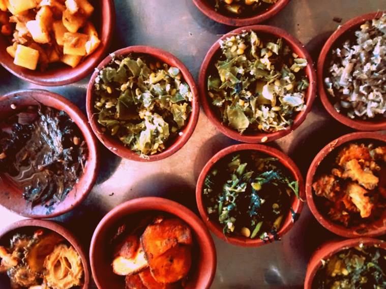 Various types of greens and vegetables cooked using cold pressed sesame oil, served in mud pots. (Photo: Puliyogare Travels)
