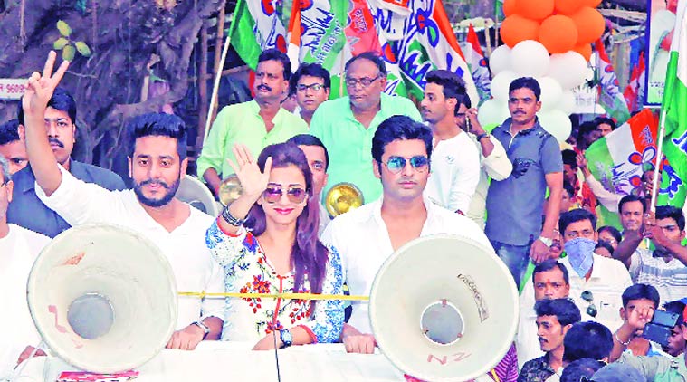 Tollywood actors Ankush (right) and Bonny with filmmaker Raj Chakraborty campaign at Bolpur in Birbhum district on Tuesday. PTI 