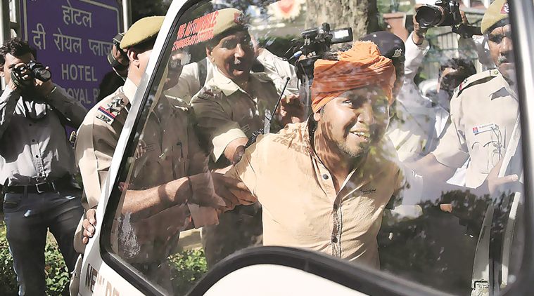Police detain Hindu Sena activists Monday. PTI 