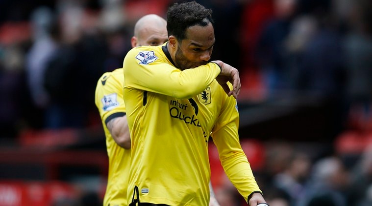 Joleon Lescott dejected at the end of the match after being relegated from the Premier League. (Source: Reuters)