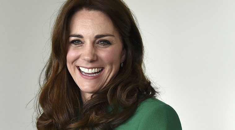 Britain's Kate, the Duchess of Cambridge, laughs,  during a visit to St Thomas' Hospital with Prince William to promote mental health issuses, in London, Thursday March 10, 2016.  (Toby Melville /Pool Photo via AP)