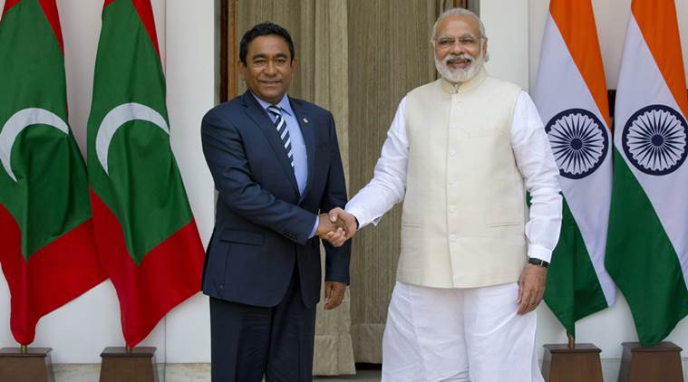 Prime Minister Narendra Modi with Maldives' President Yameen Abdul Gayoom before a delegation-level meeting in New Delhi. (AP Photo/Manish Swarup)