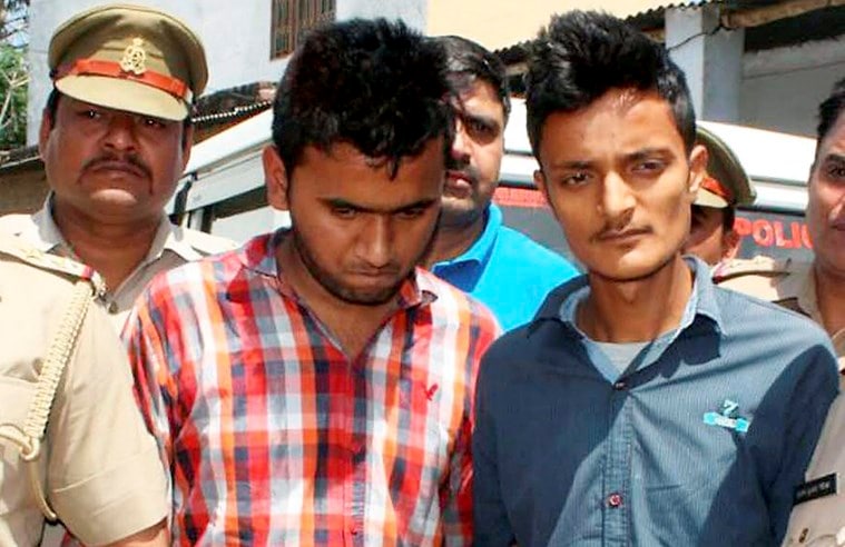 RPT...Moradabad : Accused Janu and Rehan produced in court in connection with the murder of  NIA Deputy SP Mohammad Tanzil  in Moradabad on Tuesday. PTI Photo (PTI4_12_2016_000320B)