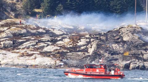 Norway helicopter crash: At least 11 bodies found, 2 people still missing, says rescue official
