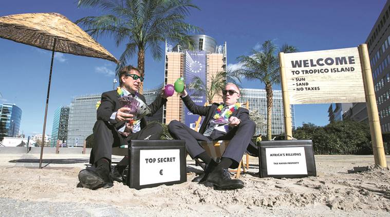 Activists take part in a demonstration outside the European Commission (EC) headquarters ahead of statements by the EC on the effectiveness of existing measures against tax evasion and money-laundering in light of the recent Panama Paper revelations, in Brussels, Belgium, April 12, 2016. REUTERS/Yves Herman TPX IMAGES OF THE DAY