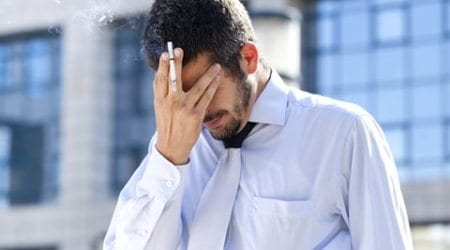 Tired businessman smoking