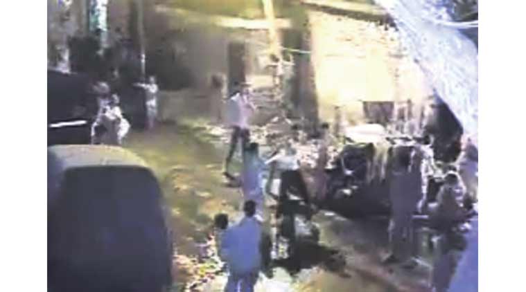 Footage from the CCTV camera installed outside their house shows three of the six men beating up the two victims.