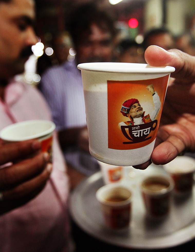 BJP workers are distributing Tea (NaMo Chai) at Dharavi to campaigning and promoting Gujarat Chief Minister and Bharatiya Janata Party's prime ministerial candidate Narendra Modi in Mumbai on Monday. Express Photo by Pradip Das. 03.03.2014. Mumbai.
