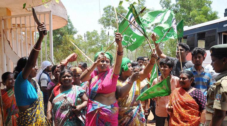 Ranchi: JMM supporters shout slogans holding bows and arrows during the Jharkhand bandh called by opposition parties to protest the Jharkhand government's domicile policy, in Ranchi on Saturday. PTI Photo(PTI5_14_2016_000066B)