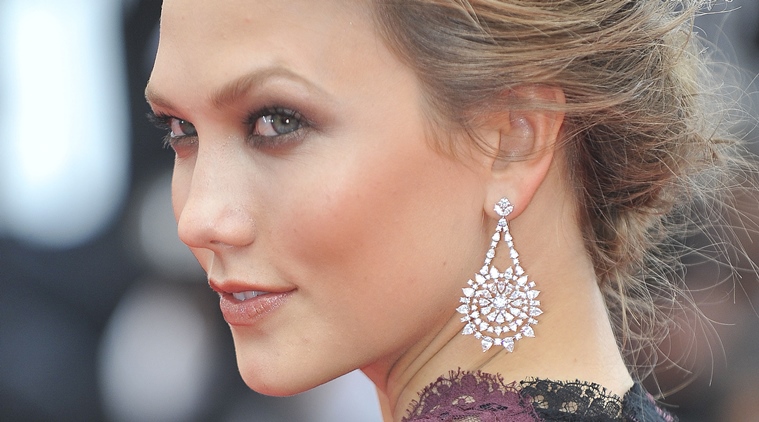 Karlie Kloss, celebrity beauty secrets, curling eyelashes, eye puffiness