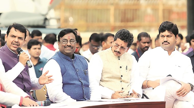 Sudhir Mungantiwar (C), state Finance minister with chief minister Devendra Fadnavis (L) and Deepak Kesarkar and Dhananjay Munde during assembly session at Vidhan Bhavan in Mumbai. Express Photo By Ganesh Shirsekar 18/03/2016