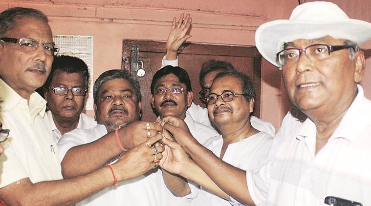 TMC mla Shilbhdra Dutta (ext left) along with other TMC leader handed over party office key towards left leaders at Barrackpore . Express photo. 26.05.16