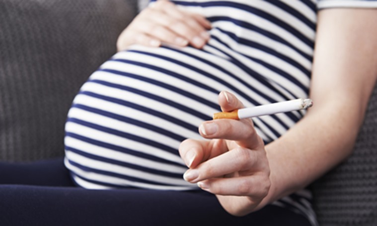 Close Up Of Pregnant Woman Smoking Cigarette