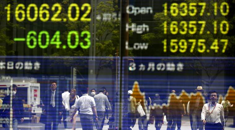 The surge in the Japanese yen and a bleak outcome from a monthly factory managers' survey did little to lighten the gloom. (AP Photo/Shizuo Kambayashi)