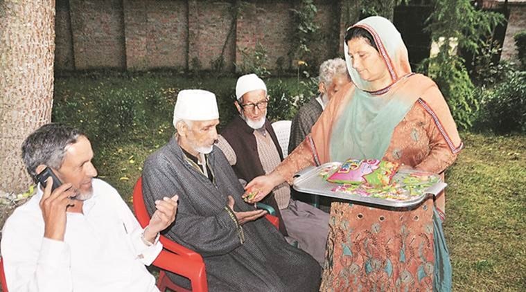 Family of Athar Khan, rank 2, celebrates in Anantnag on Tuesday. PTI photo