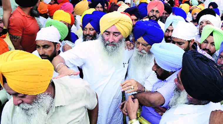 SAD MLA Ravinder Singh Brahmpura being escorted out of the complex Rana Simranjit Singh