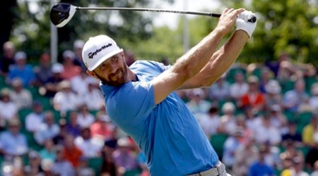 Dustin Johnson watches his tee shot  on the 10th hole during the rain delayed first round of the U.S. Open golf championship at Oakmont Country Club on Friday, June 17, 2016, in Oakmont, Pa. (AP Photo/John Minchillo)