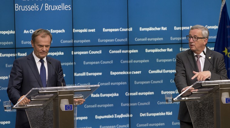 European Council President Donald Tusk, left, and European Commission President Jean-Claude Juncker address a media conference at an EU summit in Brussels on Tuesday, June 28, 2016. European Union leaders began plotting a future without Britain on Tuesday, urging the island nation and economic powerhouse to disentangle itself as fast as possible from the other 27 nations in the bloc to avoid extending the turmoil that has been roiling European and global markets. (AP Photo/Virginia Mayo)