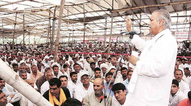 AIJASS national president Yashpal Malik urging the protesters sitting on dharna for last two weeks at Jassia village to lift dharna today in Rohtak on Sunday. June 19, 2016: Express Photo
