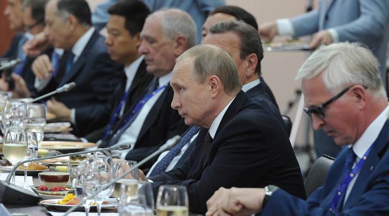Russian President Vladimir Putin, second right, meets with chief executives of international companies at the St. Petersburg International Economic Forum in St. Petersburg, Russia, Friday, June 17, 2016. At right is Head of the Russian Union of Industrialists and Entrepreneurs Alexander Shokhin. (Mikhail Klimentyev/Sputnik, Kremlin Pool Photo via AP)