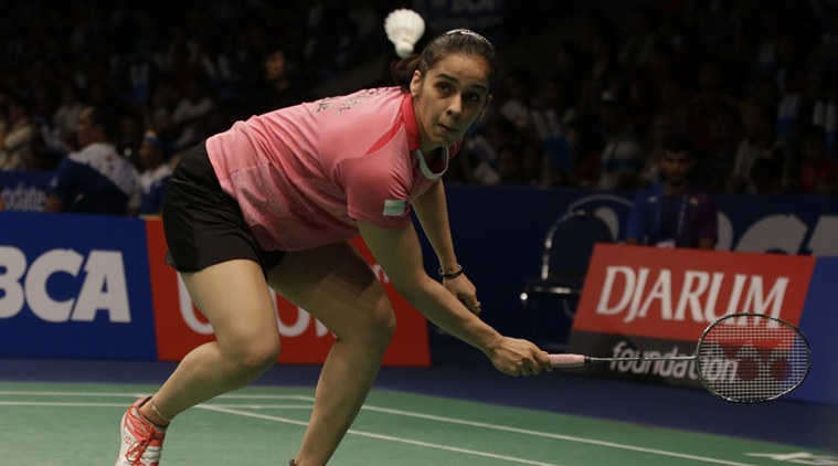 India's Saina Nehwal returns a shot to Spain's Carolina Marin during their quaterfinal women's single match at the Indonesia Open badminton tournament at Istora Stadium in Jakarta, Indonesia, Friday, June 3, 2016. (AP Photo/Achmad Ibrahim)
