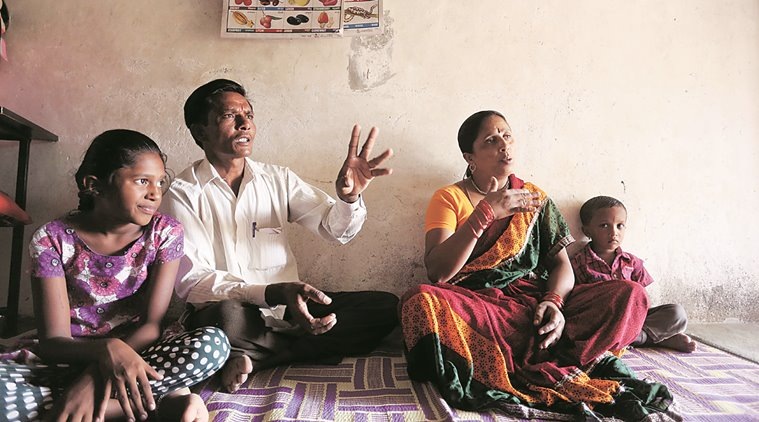 (Right) Babasaheb Mane, who owns a grocery store in Bavkarwadi village, with wife Saroja and children