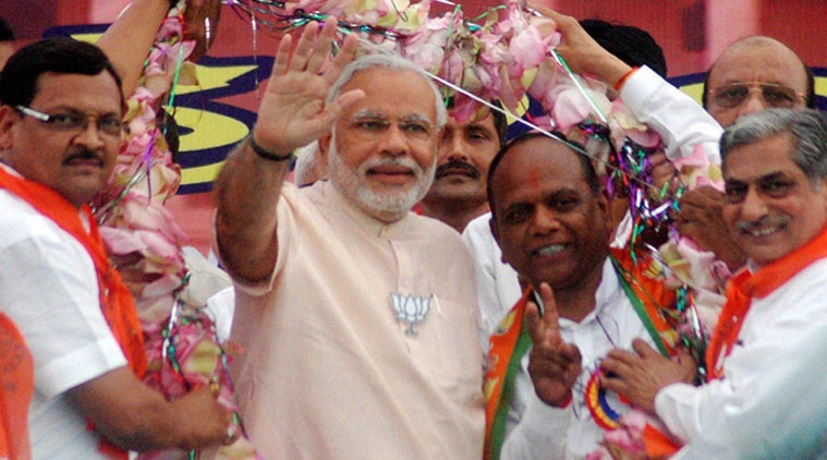 PM Narendra Modi with Mansukhbhai Vasava at a rally. (Source: PTI/File)