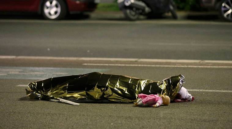 ATTENTION EDITORS - VISUAL COVERAGE OF SCENES OF INJURY OR DEATH - A body is seen on the ground July 15, 2016 after at least 30 people were killed in Nice, France, when a truck ran into a crowd celebrating the Bastille Day national holiday July 14. REUTERS/Eric Gaillard REUTERS/Eric Gaillard TPX IMAGES OF THE DAY
