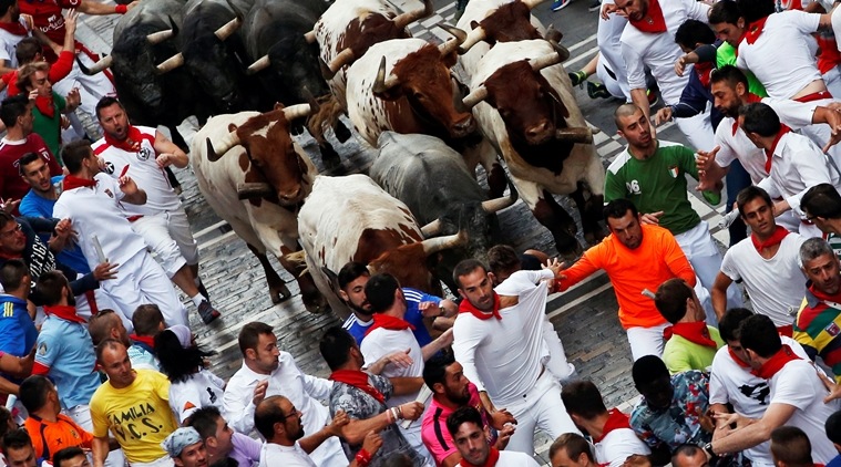 san fermin festival, bull-running festival, spain, pamplona, red cross, bull, world news, indian express